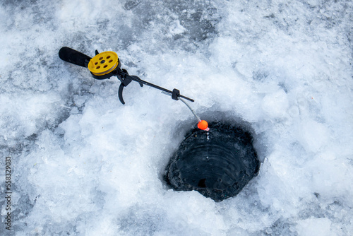 fishing rod and hole. winter fishing