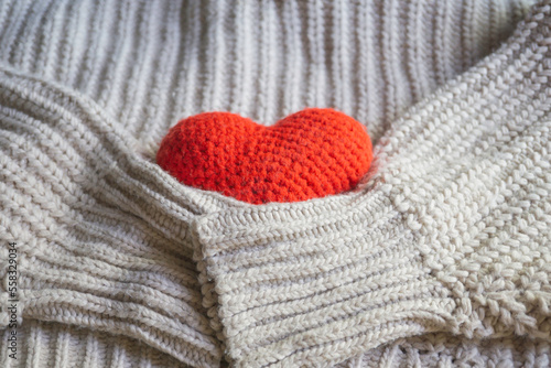 Close up of red knitted heart for Valentine’s day. Love concept.