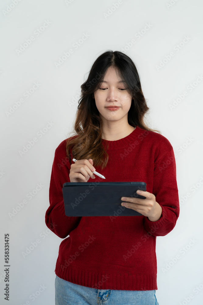 Portrait of a beautiful Asian woman standing over white background with things in hand Portrait of a beautiful Asian woman standing over white background with things in hand