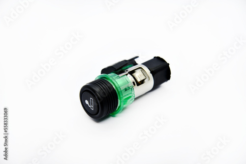 Cigarette lighter with green backlight. Spare part for the car. The electric cigarette lighter is disassembled.
