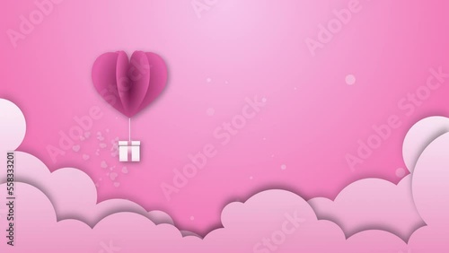 A balloon in the shape of a heart rolling motion for Valentine's day Greeting love video. 4K Romantic looped animation on for Valentine's day, St. Valentines Day,Wedding anniversary.  above the clouds
