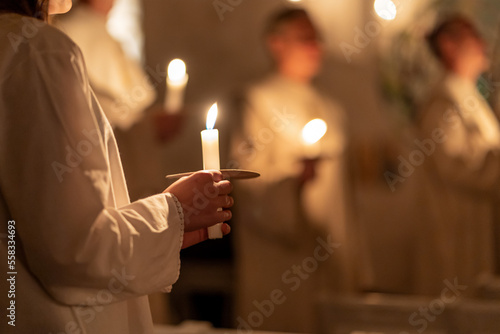 People handling candles in the hands. Christmas and lucia holidays