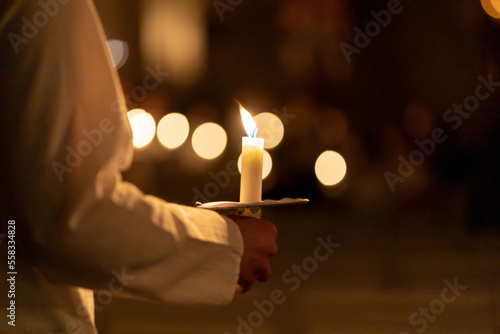 People handling candles in the hands. Christmas and lucia holidays