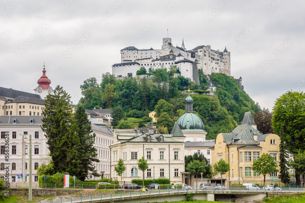 View of the Fortress of Salzburg (Hohensalzburg) from the Salzach River, Salzburg , Austria.