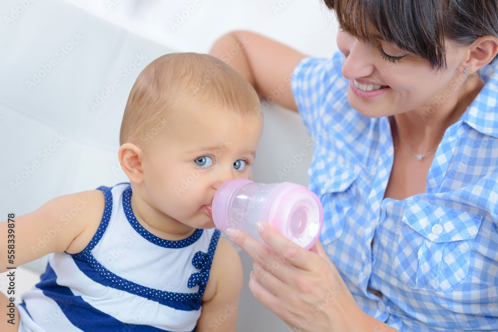 baby drinking milk from the bottle baby drinking milk from the bottle