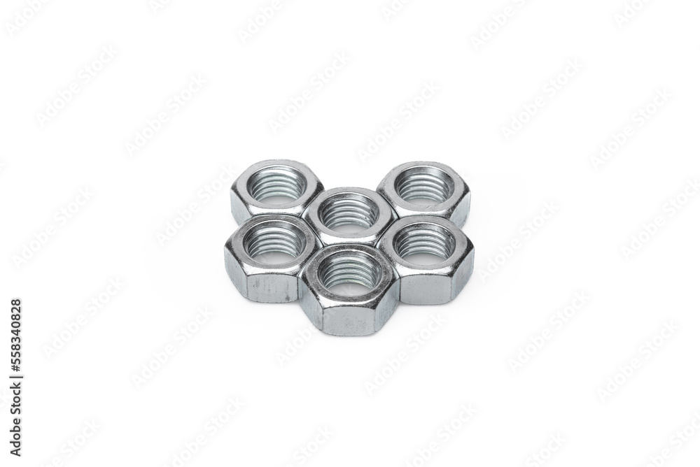 Set of steel nuts. On an isolated white background. With scratches. Close-up studio macro photography.