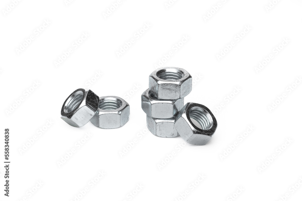 Set of steel nuts. On an isolated white background. With scratches. Close-up studio macro photography. Set of steel nuts. On an isolated white background. With scratches. Close-up studio macro photography.