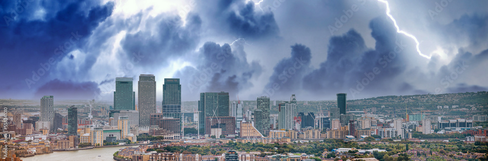 London - UK. Aerial panoramic view of Canary Wharf modern buildings during a storm
