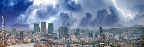 London - UK. Aerial panoramic view of Canary Wharf modern buildings during a storm