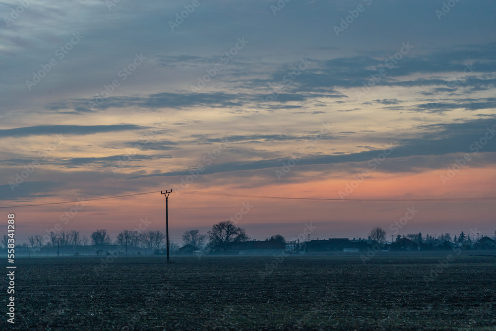 Sunrise over the fields, colourful sky