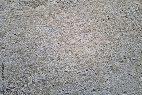 View of the concrete wall of the building, gray background, texture.