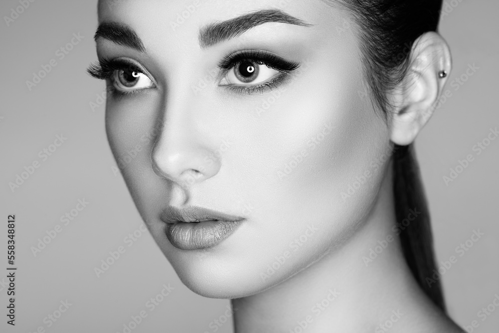 Fototapeta premium Beautiful woman face. Perfect makeup. Beauty fashion. Eyelashes. Lips. Cosmetic Eyeshadow