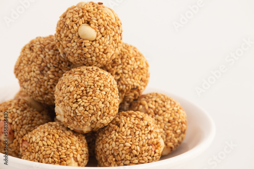 Indian Winter Delicacy White Ball Shaped Tilgul Laddu Or Safed Til Ki Laddo Is Made Of Roasted Sesame Seed, Jaggery, Gur, Peanut, Gud, Mungfali Is Enjoyed In Winter On Makar Sankranti and Lohri