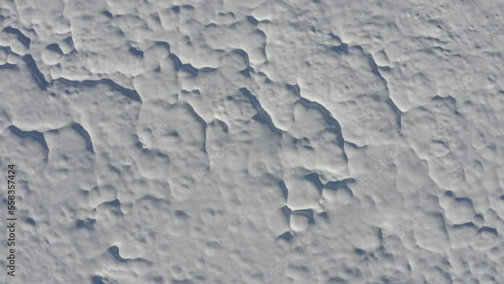 Aerial - Interesting wave pattern made on top of the soil by the snow in a forest field Aerial - Interesting wave pattern made on top of the soil by the snow in a forest field