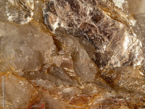 macro shooting of natural mineral stone -  Muscovite in Quartz (Dioctahedral mica, common mica isinglass potash mica)  .It is a hydrated phyllosilicate mineral of aluminium and potassium.