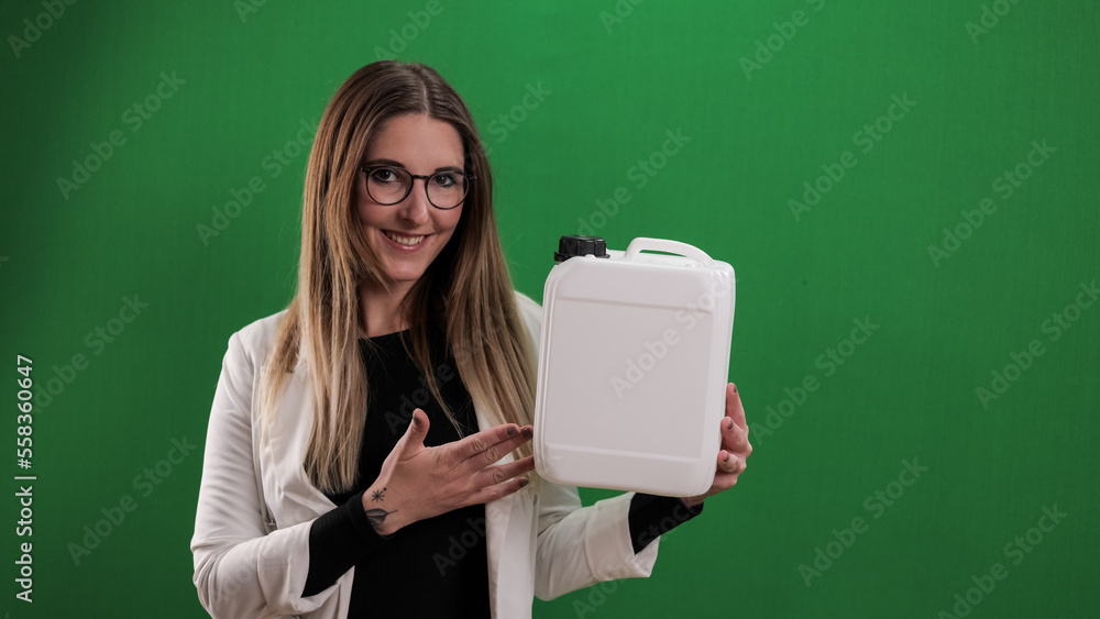 Young woman holds a canister - ideal for mock up - studio photography Young woman holds a canister - ideal for mock up - studio photography