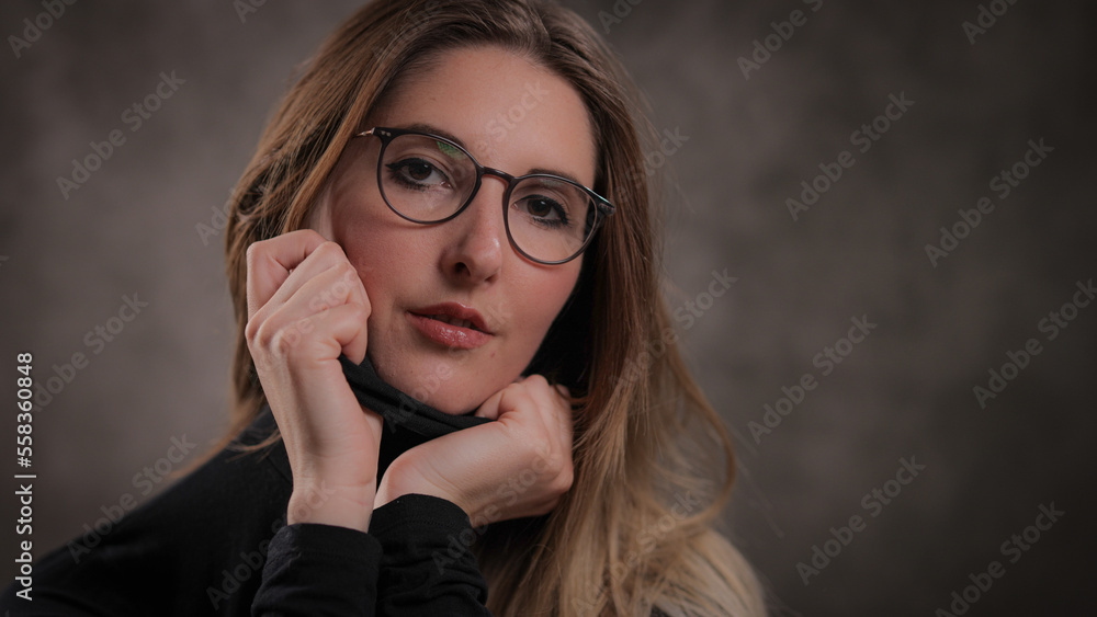 Photo shooting with a young attractive woman in a studio - studio photography Photo shooting with a young attractive woman in a studio - studio photography
