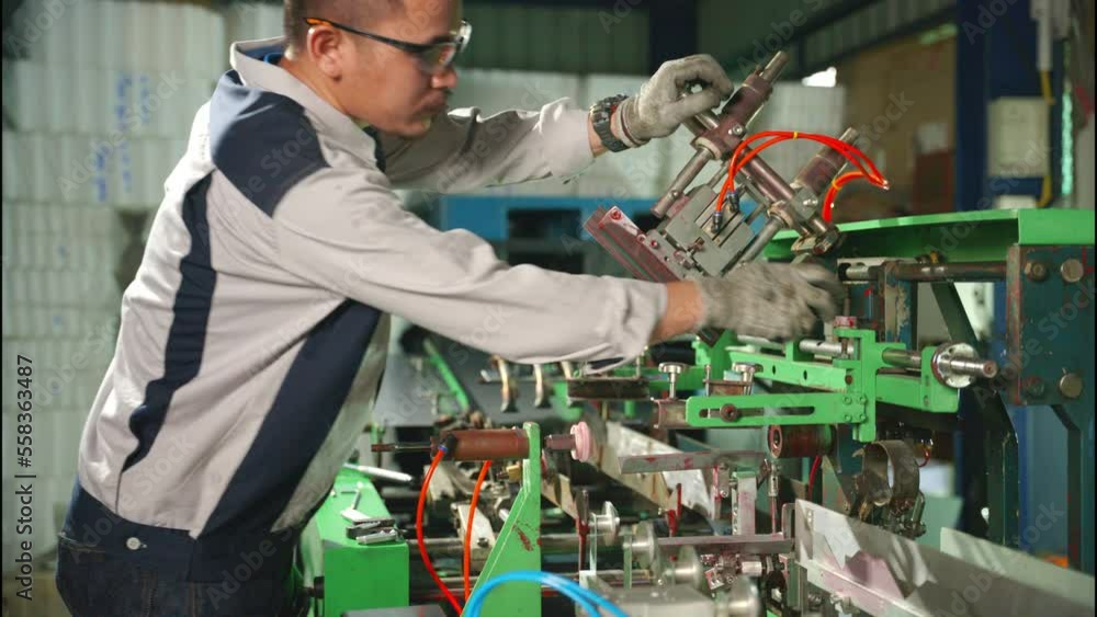 The Asian technician maintained the module of the machine in the factory. The Asian technician maintained the module of the machine in the factory.