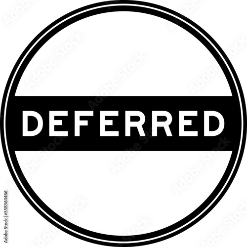 Black color round seal sticker in word deferred on white background