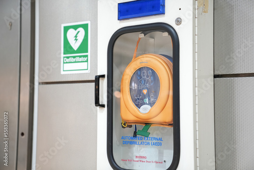 Automatic External Defibrilator (AED) device for first aid usage in a public space like train station or airport. Safety measures for public health. photo