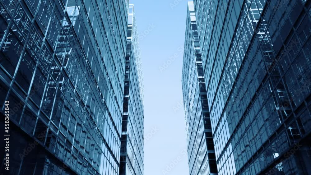 Abstract modern business architecture. Walls made of glass and steel with reflections of buildings and blue sky. Abstract modern business architecture. Walls made of glass and steel with reflections of buildings and blue sky.