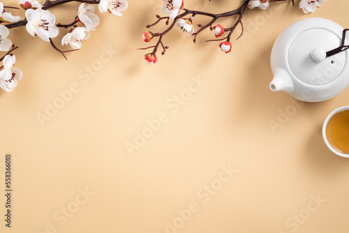 Chinese lunar new year background design concept with white plum flower and festive decoration.