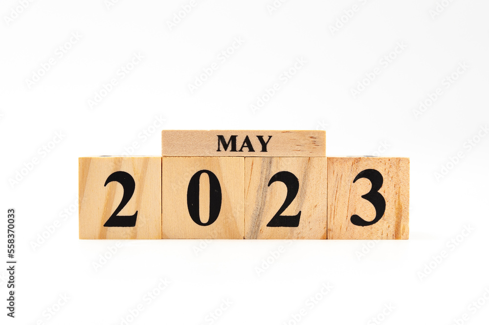 May 2023 written on wooden blocks isolated on white background with copy space