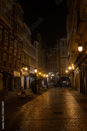 Pedestrian narrow street at night. Lights are on and there are no people, loneliness. © Pablo Santos Somos