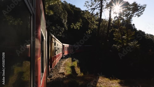 Toy train running from Kalka to Shimla or Simla capital of Himachal Pradesh north India Himalayas. Indian mountain railway photo