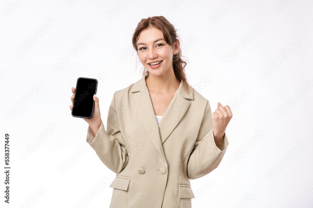 Portrait photo of young beautiful Asian woman feeling happy or surprise shock and holding smart phone on white background can use for advertising or product presenting concept. Portrait photo of young beautiful Asian woman feeling happy or surprise shock and holding smart phone on white background can use for advertising or product presenting concept.