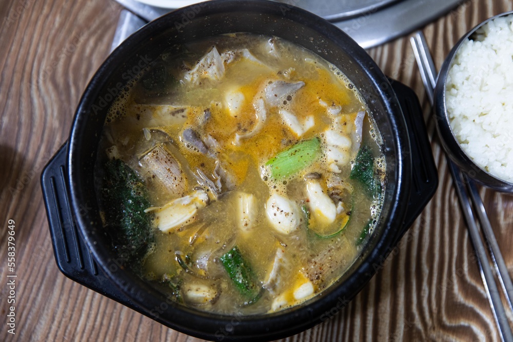 Boiled beef intestines, japchae, soybean paste, vegetables, and green onions in an earthen pot, Korean traditional food, Boiled beef intestines, japchae, soybean paste, vegetables, and green onions in an earthen pot, Korean traditional food,