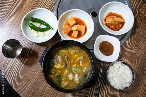 Boiled beef intestines, japchae, soybean paste, vegetables, and green onions in an earthen pot, Korean traditional food,