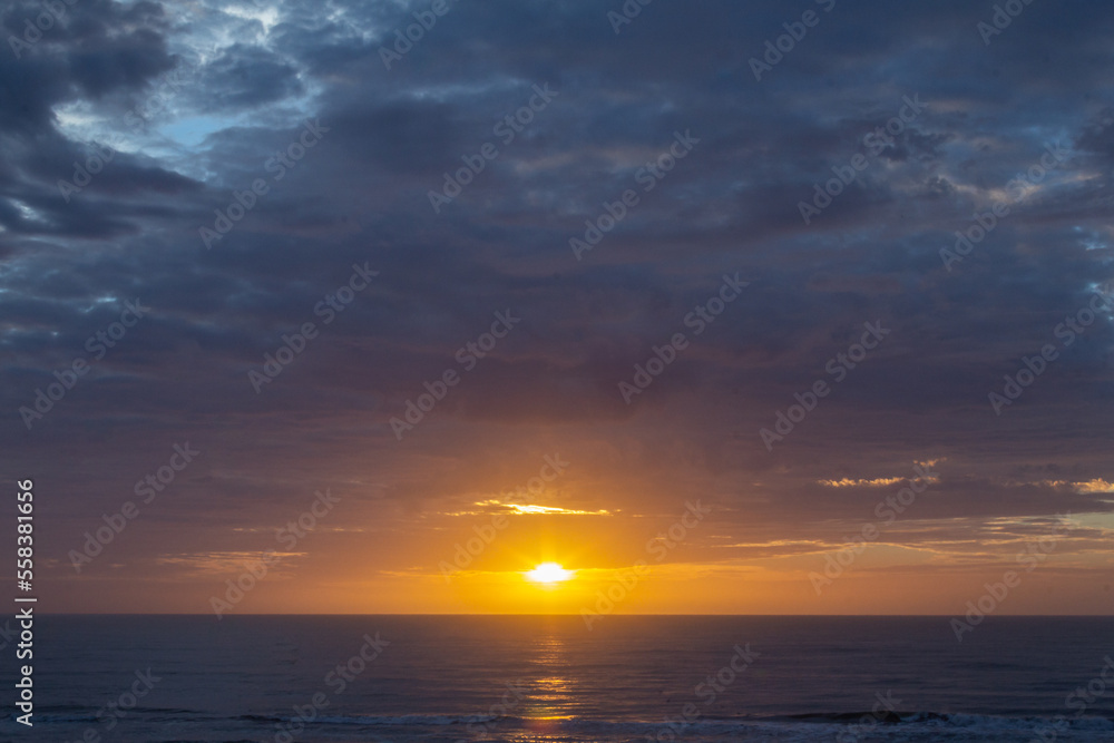 Colorful sunrise, with clouds, over the sea