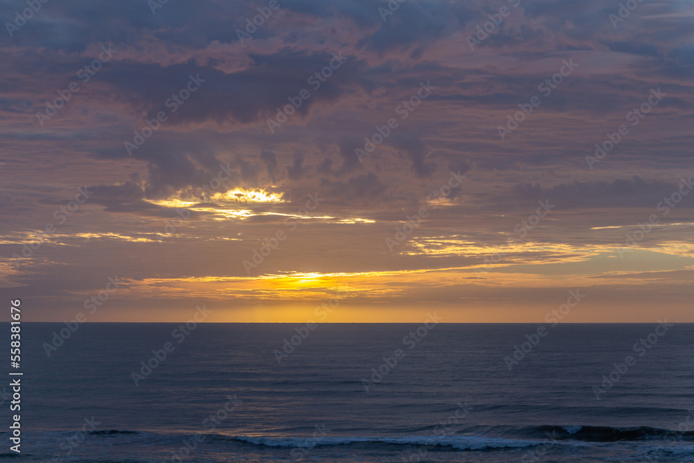 Colorful sunrise, with clouds, over the sea