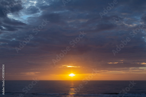 Colorful sunrise, with clouds, over the sea