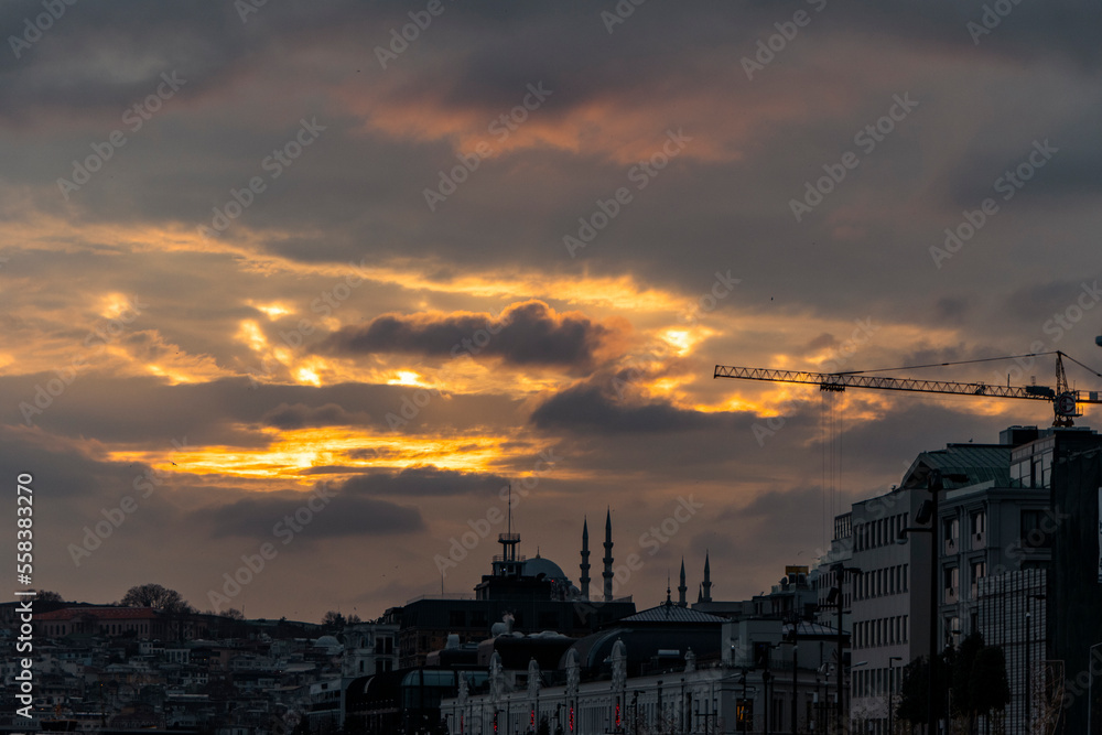 Cityscape of Istanbul, Turkey at sunset time with dramatic sky clouds