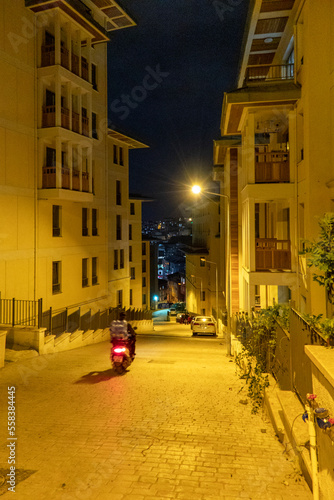 Night View of Narrow Istanbul Street with Yellow Light and City View