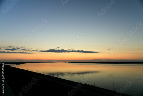 Calm sunset Volga bright Yar, calm evening on the river
