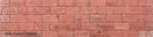 Painted and weathered long brick wall background panorama, graphic resource, horizontal aspect