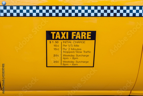 Photography Taxi fares displayed on the side of a yellow cab in New York City in the1990s