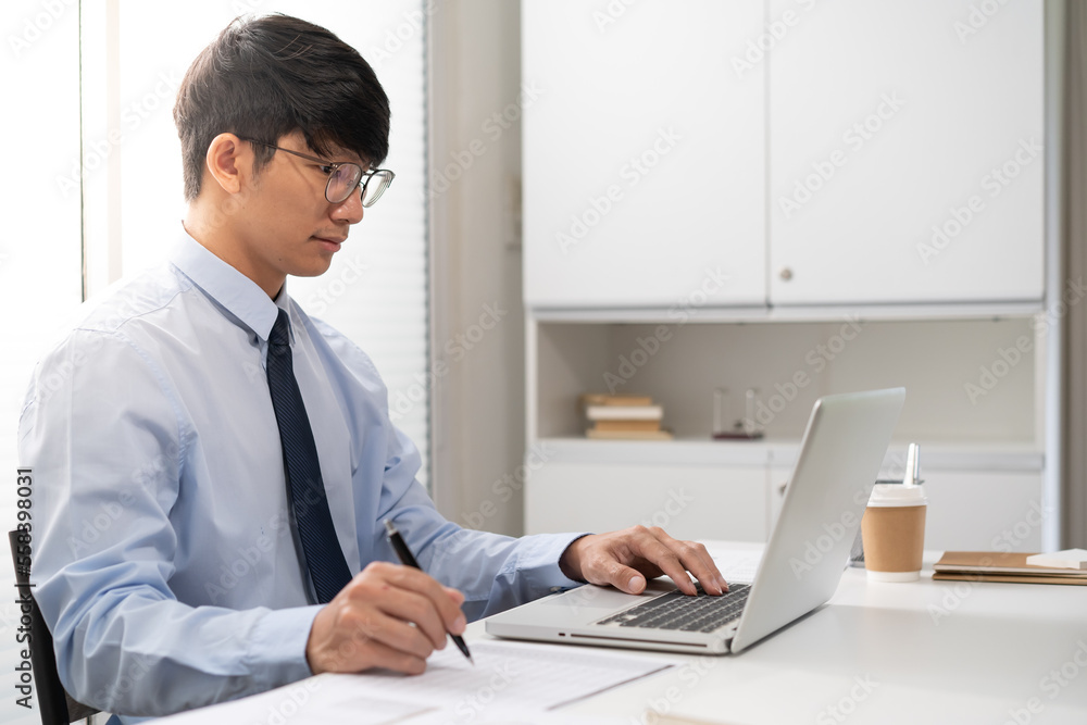 Business man working by using laptop computer Hands typing on a keyboard. Professional investor working new start up project. business planning in office. Technology business Business man working by using laptop computer Hands typing on a keyboard. Professional investor working new start up project. business planning in office. Technology business