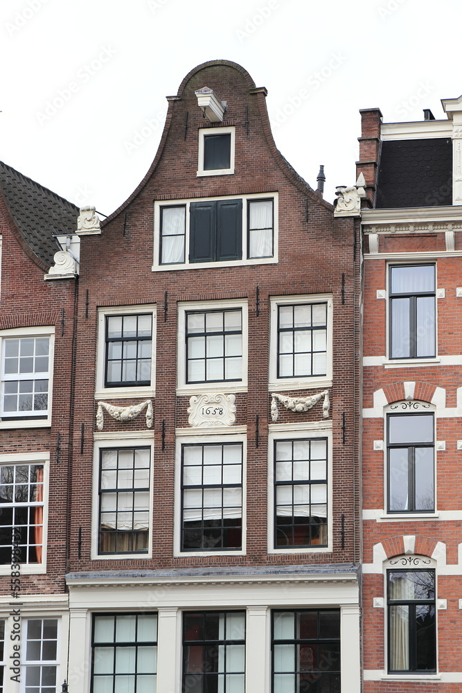 Fototapeta premium Amsterdam Canal House with Bell Gable and 1658 Inscription, Netherlands