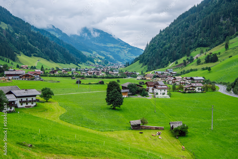 The valley Grossarltal known as the “valley of alpine pastures” in the Hohe Tauern National Park, Austria. Beautiful green alpine valley on a cloudy summer day.
