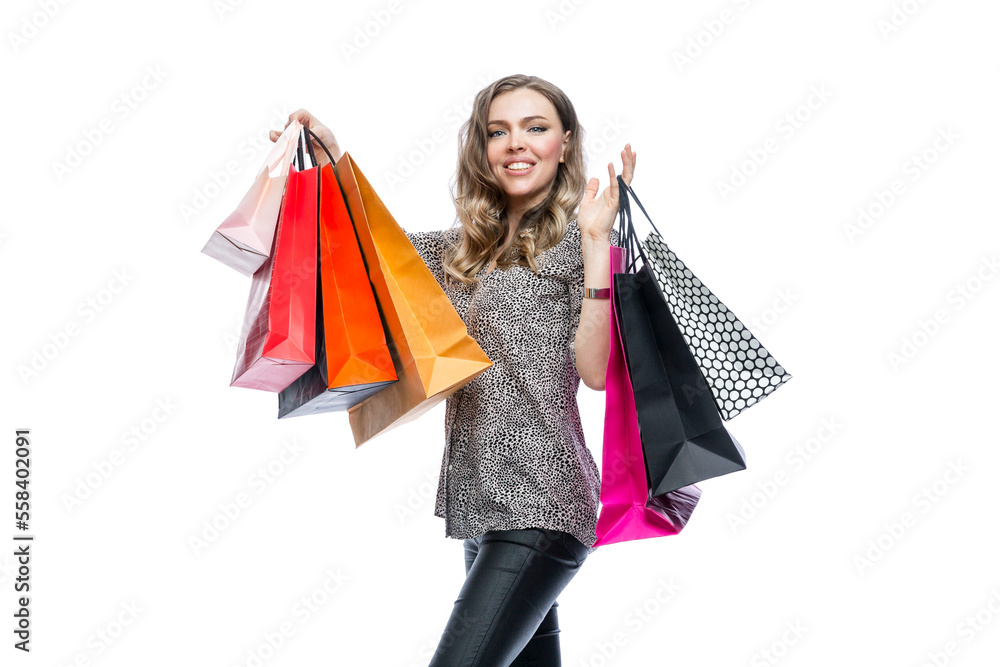 Happy woman with colorful paper bags from boutiques. Shopping during the sales season. Isolated on white background. Space for text.