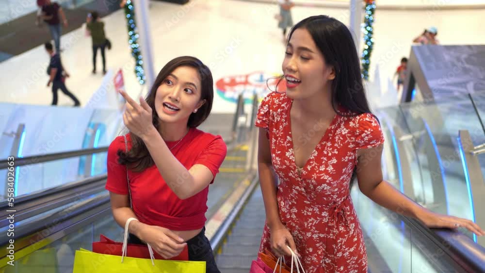 asian female friends shopping at the mall asian female friends shopping at the mall