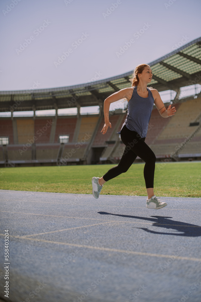 Gorgeous girl running at the stadium Gorgeous girl running at the stadium