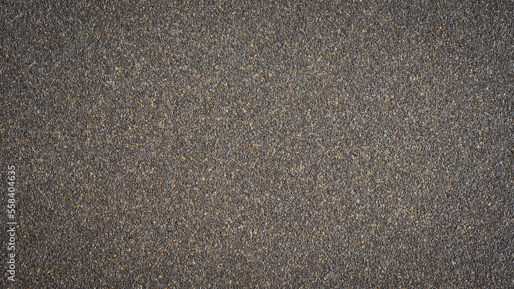 Rough grain brown black sand paper background texture Rough grain brown black sand paper background texture