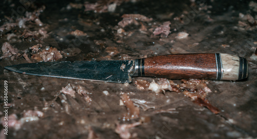 hunting knife on a wooden table