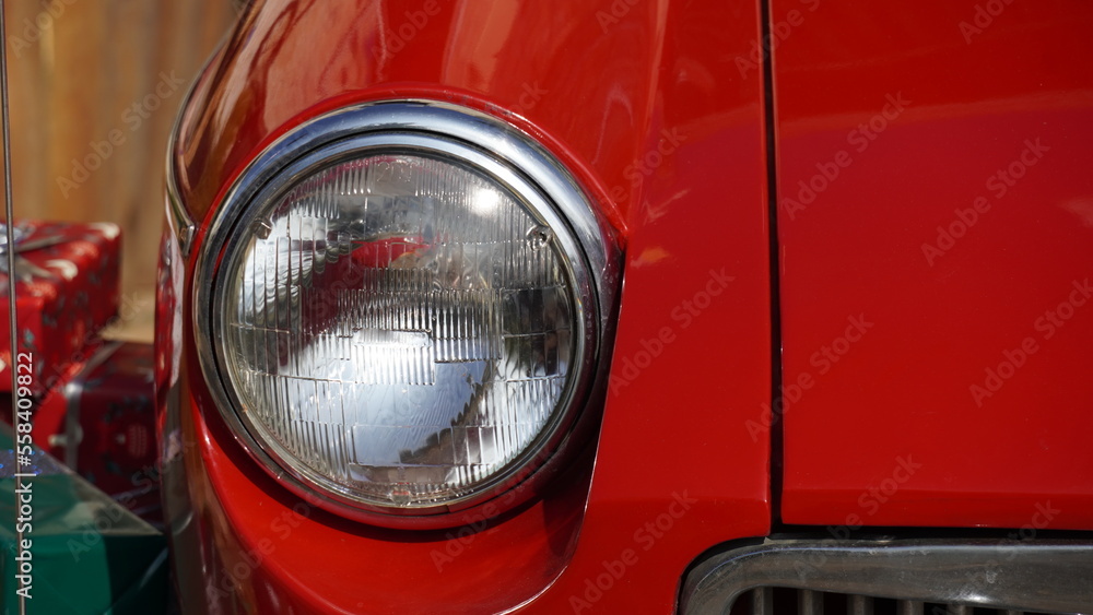 Vintage red car front with a light. Present concept
