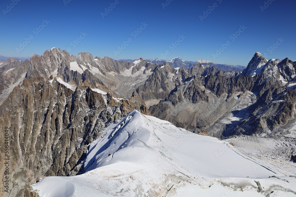 Viewpoint from the Aiguille du Midi which  is a 3,842-metre-tall mountain in the Mont Blanc massif within the French Alps
